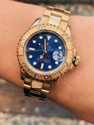 Rolex Yachtmaster Mid - Size 69628,  29mm,  18k Yellow Gold,  Blue Dial & Box Woman