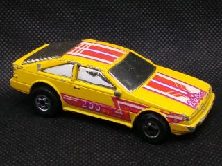 1986 Hot Wheels Flippin Frenzy Nissan 200sx Flip - Outs Yellow 1/64 Loose