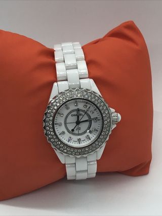 Chanel J12 White Ceramic Watch With Diamond Bezel.