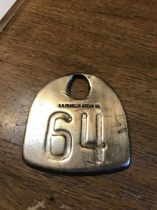 Vintage Double Sided Numbered 64 Brass O.  M.  Franklin Serum Co.  Cattle / Cow Tag