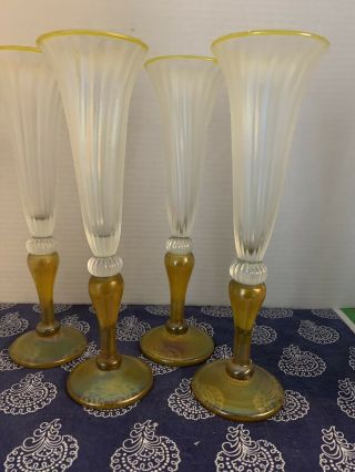 Four Rick Strini Champagne Flutes With Yellow Stems