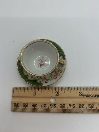 Vintage Mini Tea Cup W/saucer Occupied Japan.  Gold Edging White/green Floral.