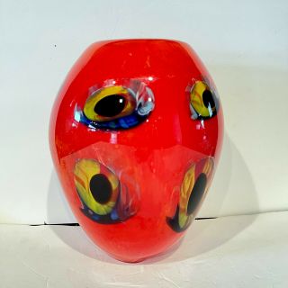 A Murano Hand Blown Art Glass Red Vase With Eyes Clear Base