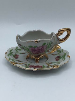 Vintage Hand Painted Four Footed Teacup And Saucer Gold Gilding