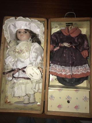 A Vintage Wood Boxed Porcelain Doll With 2 Dresses In Seperate Part Of Box