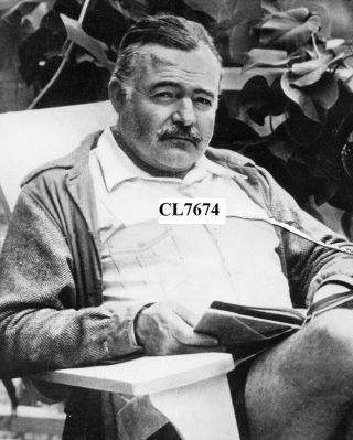 Ernest Hemingway Reading A Book In The Garden Of His Home Photo
