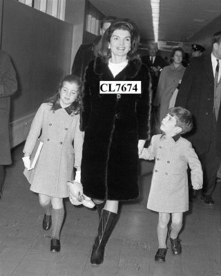 Jacqueline Kennedy In A Fur Coat With Caroline And John F.  Kennedy Jr At Airport