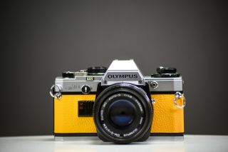 Olympus Om10 35mm Film Camera W/ 50mm F/1.  8 Zuiko Lens Yellow Leather | Serviced