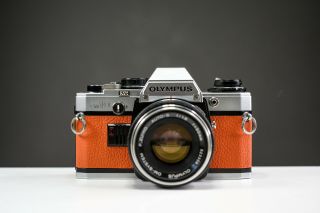 Olympus Om10 35mm Film Camera W/ 50mm F/1.  8 Zuiko Lens Orange Leather | Serviced