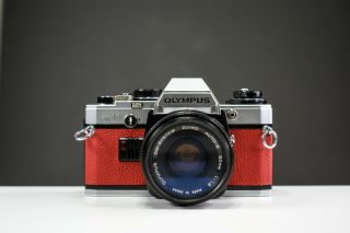 Olympus Om10 35mm Film Camera W/ 50mm F/1.  8 Zuiko Lens Red Leather | Serviced