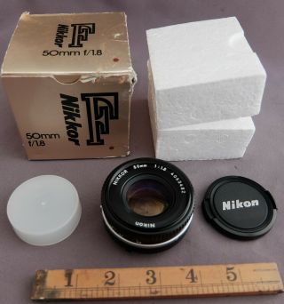 Nikon Nikkor 50mm F1.  8 Pancake Lens Apparently In Red Dot Box.