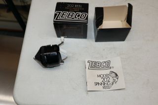 Vintage Black Zebco 202 Reel In W/ Box And Brochure