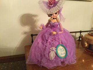 Elegant Vintage Bradley Doll.  13” Purple Gown,  Tag,  Parasol,  Hat,  Stand