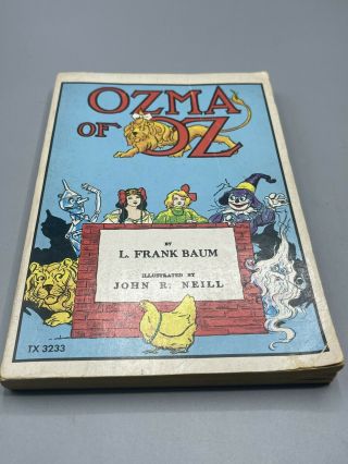 Ozma Of Oz By L.  Frank Baum.  Scholastic Book Services (1975).