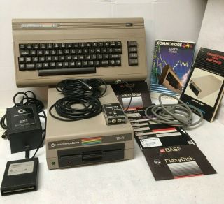 Commodore 64 Computer Console Keyboard,  1541 Floppy Disk,  Power,  Manuals